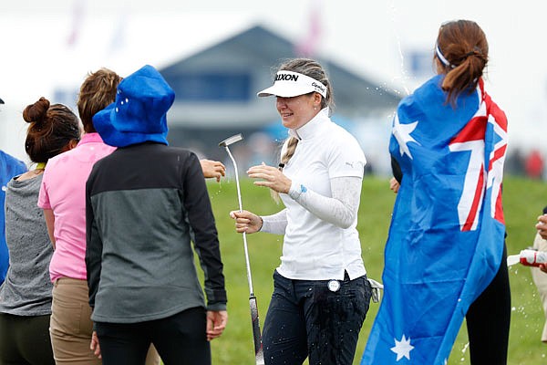 Hannah Green celebrates with fans Sunday after winning the KPMG Women's PGA Championship in Chaska, Minn.