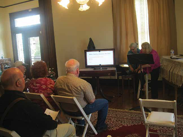 Christine Woodrow, top left, New Boston Library director, speaks Saturday to local residents gathered at the PJ Ahern Museum located near the Miller County Courthouse in Texarkana, Ark. Woodrow delivered a lecture focusing on this year marking Arkansas' bicentennial year in becoming part of U.S. territory in 1819.