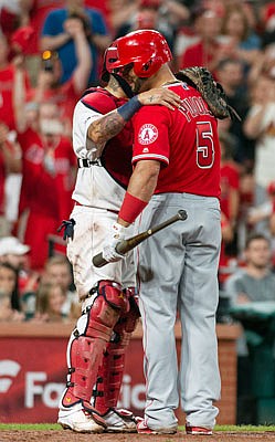 Cardinals catcher Yadier Molina hugs his former teammate Albert Pujols after Pujols' last at bat of the game during the ninth inning of Sunday night's game at Busch Stadium.