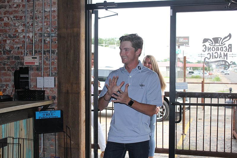 Garrett May walks into Redbone Magic Brewing on Monday in Texarkana, Texas.
