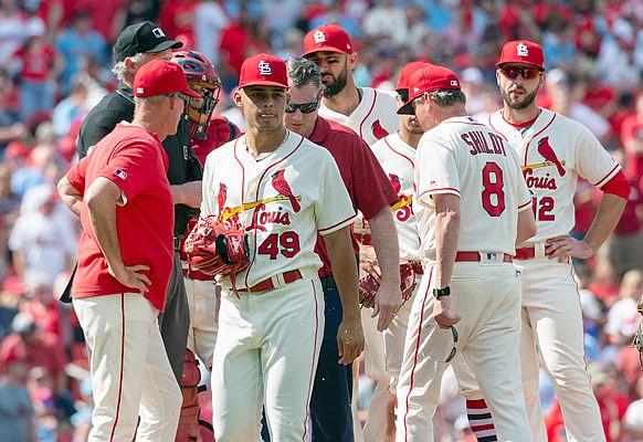 Jordan Hicks of the Cardinals leaves last Saturday's game against the Angels at Busch Stadium with an injury.