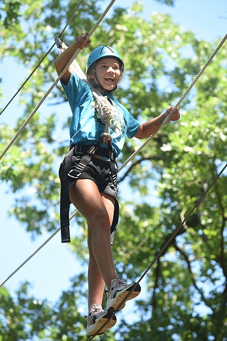 This week has 33 students, including Kambell Winegar, 11, participating in the Jefferson City Parks and Recreation's Binder Adventure II. Tuesday's activity featured the ropes challenge course in the woods at Binder Park.