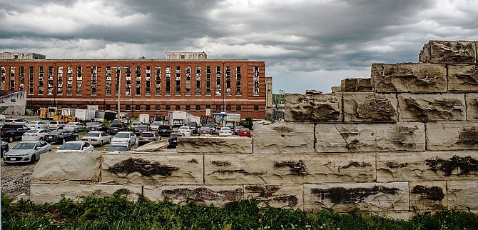 The stone wall of the old Missouri State Penitentiary in the 700 block of East Capitol Avenue was heavily damaged in the May 22, 2019, tornado, as seen by the crumbled ruins in the foreground. Several buildings on the campus of the historic penitentiary suffered considerable structural damage in the twister.