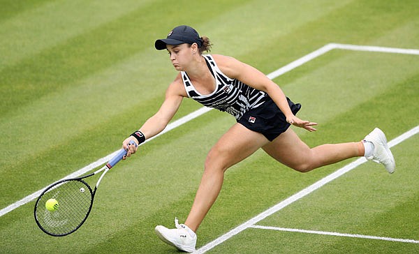 Ash Barty reaches to make a return during her match Sunday against Julia Goerges in Birmingham, England.