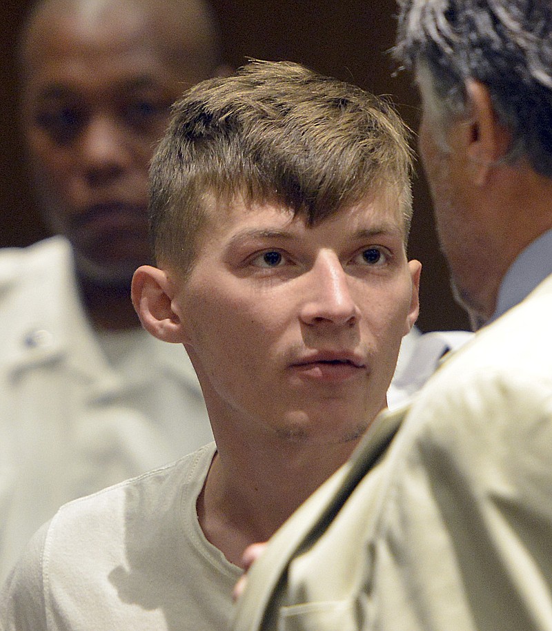 Volodymyr Zhukovskyy, 23, of West Springfield, stands during his arraignment in Springfield District Court, Monday, June 24, 2019, in Springfield, Mass. Zhukovskyy, the driver of a truck in a fiery collision on a rural New Hampshire highway that killed seven motorcyclists, was charged Monday with seven counts of negligent homicide.  (Don Treeger/The Republican via AP, Pool)