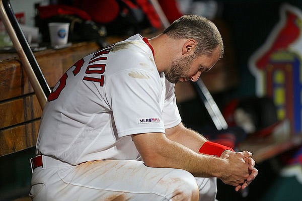 Paul Goldschmidt sits in the Cardinals dugout during the fifth inning of Tuesday night's game against the Athletics at Busch Stadium.