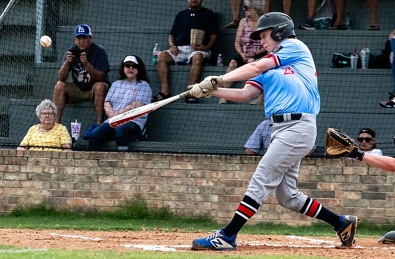 Texarkana Bulldogs designated hitter Zane Cox hits the ball pitched from the Texarkana Razorbacks on Tuesday at Joe Blagg Field in Ed Worrell Memorial Park. 