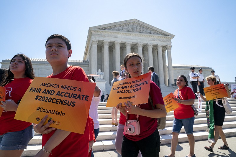 Young demonstrators gather at the Supreme Court as the justices finish the term with key decisions on gerrymandering and a census case involving an attempt by the Trump administration to ask everyone about their citizenship status in the 2020 census, on Capitol Hill in Washington, Thursday, June 27, 2019. (AP Photo/J. Scott Applewhite)