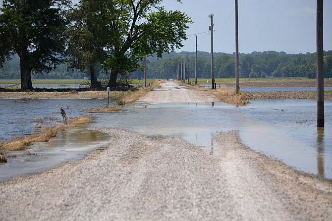 Floodwater covers portions of South Bush Landing Road on Friday, June 28, 2019, in Hartsburg, Mo. 