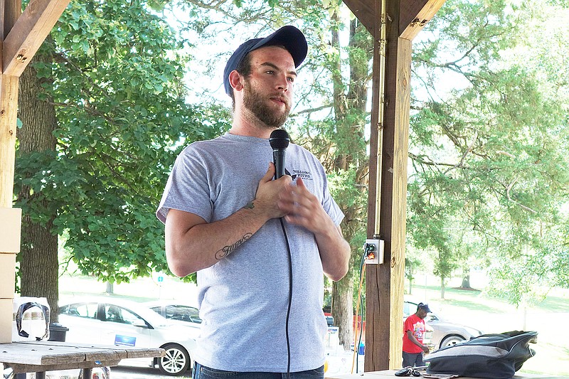 During Saturday's Hugs not Drugs event, Jasper Taylor talks about his own experience facing an addiction to heroin. The event promoted awareness of addiction issues and resources in the community.