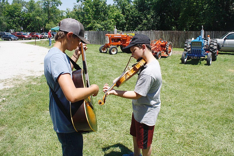 Tanner Marriott accompanies 12-year-old fiddler Preston Marriott. Preston competed in the open division and took home fourth place against a talented group.