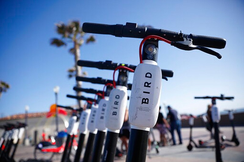 Bird scooters are seen along Mission Beach boardwalk  May 28 in San Diego. The two largest scooter companies in the U.S., Bird and Lime, generally place the responsibility for accidents on riders by listing in their rental agreements that riders relieve the companies of liability. Customers must agree to those terms to ride.  Bird says riders are fully insured for anything that might happen as a result of a faulty Bird scooter. 
 
