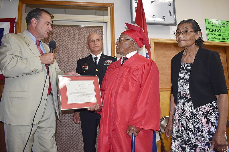 From left, Lt. Gov. Mike Kehoe and former United States Army Maj. Gen. Hank Stratman present Tipton native James Shipley with an honorary high school diploma during a Sunday ceremony. Shipley's wife, Mildred, stands beside him. Shipley wasn't able to complete high school, but went on to serve as a crew chief with the famed Tuskegee Airmen in Italy during World War II.