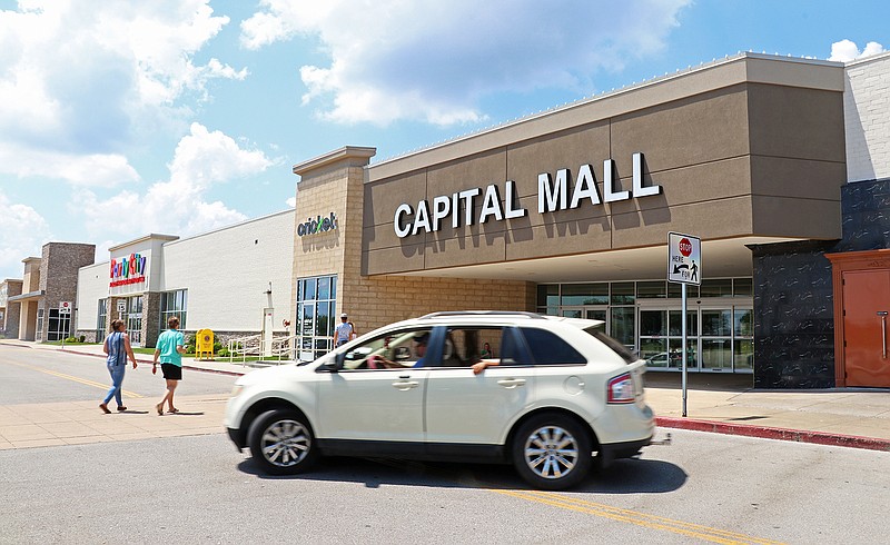 A car drives by the front entrance of Capital Mall in Jefferson City.