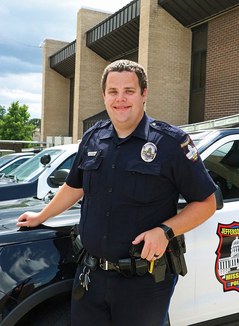 Police officer Charlie St. Onge stands outside the Jefferson City Police Department. Onge received the city's June employee service award.