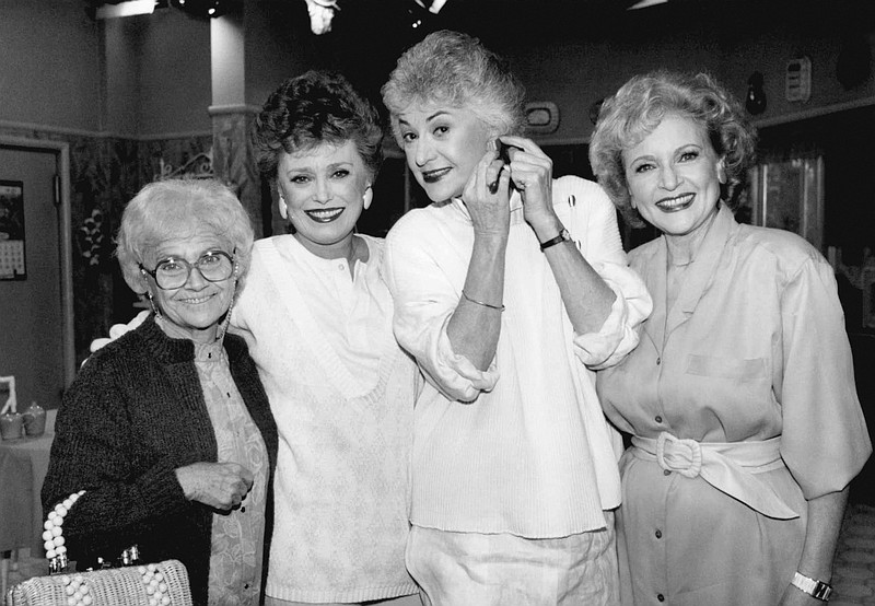 FILE - This Dec. 25, 1985 file photo shows the stars of the television series "The Golden Girls" , from left, Estelle Getty, Rue McClanahan, Bea Arthur and Betty White during a break in taping in Hollywood, Calif.  The sitcom, which followed four women of a certain age living together in Miami, aired on NBC from 1985 to 1992. Nearly 35 years later, it continues to gain new fans and has inspired a wave of merchandising.  (AP Photo/Nick Ut, File)