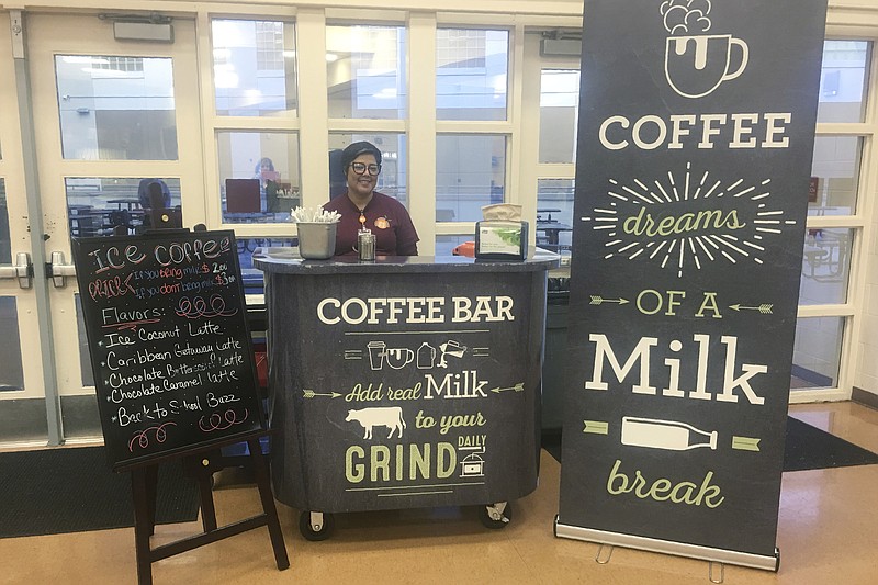 This Feb. 22, 208 photo provided by Orange County Public Schools shows a coffee stand at Cypres Creek High School in Orlando, Fla. Orange County schools did not receive dairy industry grants for the coffee bars, but the local dairy council provided chalkboard-style signs and menus. (Orange County Public Schools via AP)