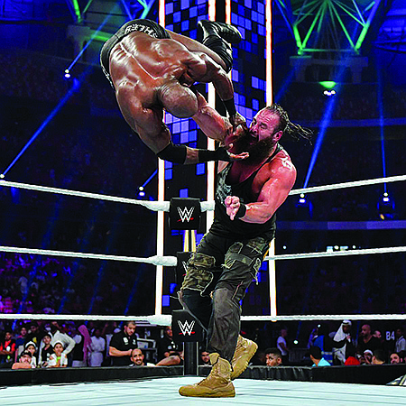 WWE warriors Braun Strowman, standing, and Bobby Lashley do battle. The WWE brings its Live SumerSlam Heatwave Tour to the Four States Fairgrounds on Friday, July 26.