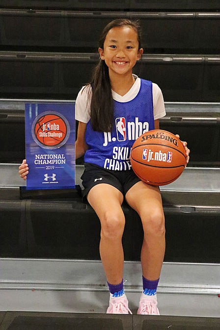 Maddy Larkin, 11, shows off her Jr. NBA Skills Challenge National Champion basketball and trophy at The Linc. Larkin won the 2019 Skills Challenge girls 11 and under category in New York City.