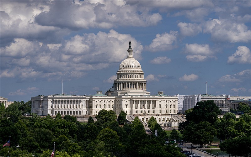 In this June 20, 2019 photo, the Capitol is seen from the roof of the Canadian Embassy in Washington. Health care is on the agenda for Congress when lawmakers return, and it’s not another battle over the Obama-era Affordable Care Act. Instead of dealing with the uninsured, lawmakers are trying to bring down costs for people who already have coverage.  (AP Photo/J. Scott Applewhite)