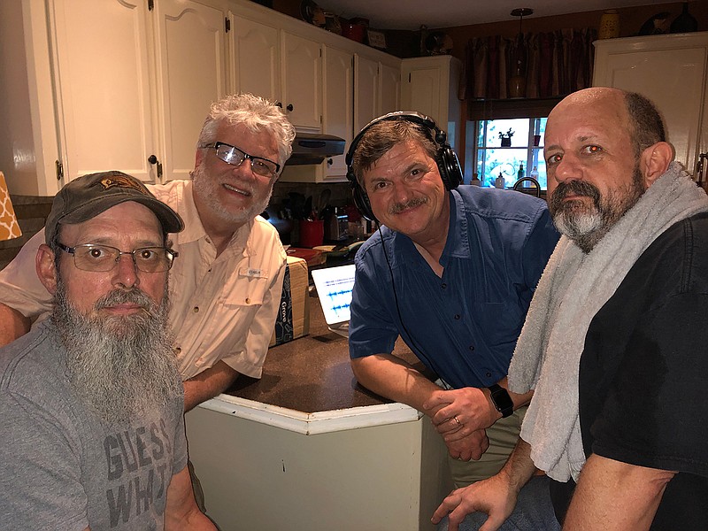 Newspaper columnist John Moore, second from right, poses with his high school rock band bandmates, from left, bass player Darin Cupp, drummer Allen Funderburk and lead guitarist Steve Scarborough during a June 6 reunion and jam session in Texarkana, Texas. The reunion was the first time some of the band members had seen each other since 1979. (Submitted photo)