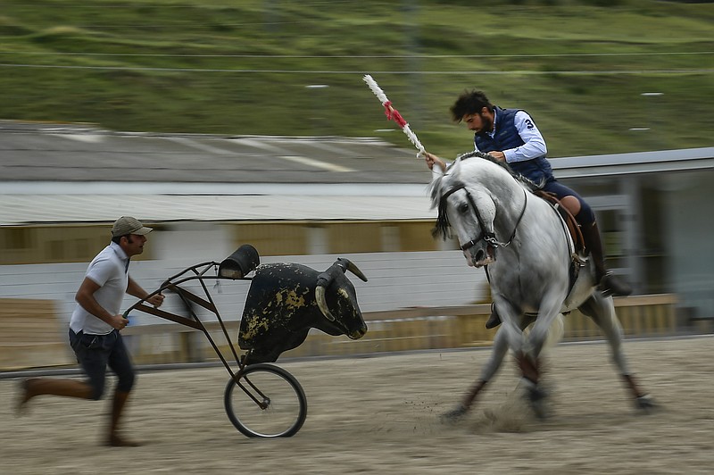 In this Friday, June 28, 2019 photo, Roberto Armendariz rides one of his horse known as 'Diamante'', during a training sesion, at his ranch in Noain, northern Spain. Of all traditions surrounding the varied world of bullfighting, the horse mounted "rejoneo" bullfighter is among the least understood. Those who love it consider it a skilled art form; others see it as a cruel and bloody crime for the sake of entertainment. (AP Photo/Alvaro Barrientos)