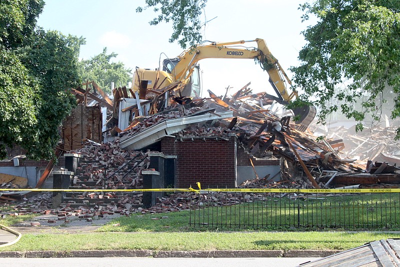 The east door of the Latham Sanitarium was the last to fall during its July 8, 2019, demolition.