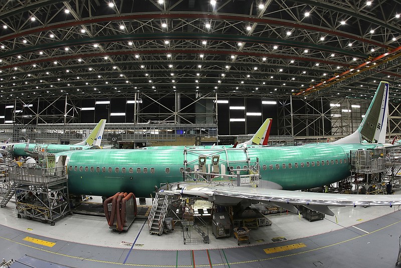 FILE- In this March 27, 2019, file photo, a Boeing 737 MAX 8 airplane is shown on the assembly line during a brief media tour in Boeing's 737 assembly facility, in Renton, Wash. Flyadeal, a Saudi budget carrier says it is ordering 30 new Airbus planes, replacing a $6 billion agreement it had with Boeing for its troubled 737 MAX jets, which are grounded around the world after two crashes.  (AP Photo/Ted S. Warren, File)