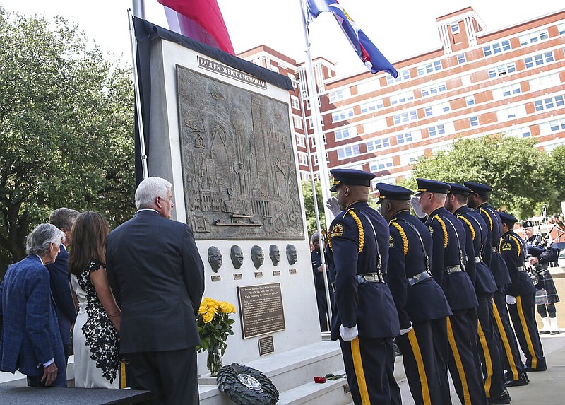 A memorial in honor of the five officers fatally shot during an ambush on July 7, 2016 is unveiled at the Jack Evans Police Headquarters in Dallas on Monday, July 8, 2019. (Ryan Michalesko/The Dallas Morning News via AP)