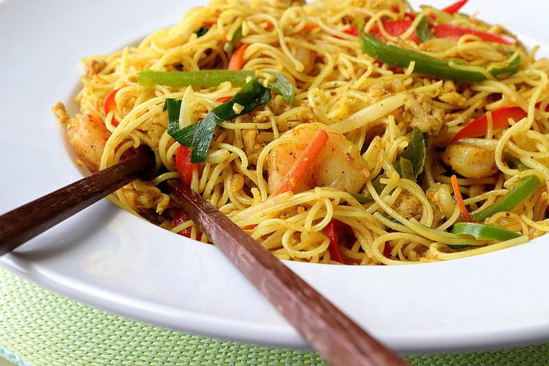 Singapore noodles, a curried thin noodle dish with chicken and shrimp and egg and vegetables, on Wednesday, June 5, 2019. (Hillary Levin/St. Louis Post-Dispatch/TNS)