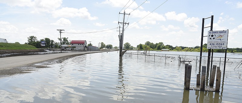 Julie Smith/News Tribune
Now that the water has receded in north Jefferson City, several of the roadways and streets are now free of water but it does still cover low-lying portions of the driving lanes and nearby fields. This is Rt. W near the 63 YMCA Sports Complex which is finally open but the ball fields and farm fields are still under several inches of floodwater. 