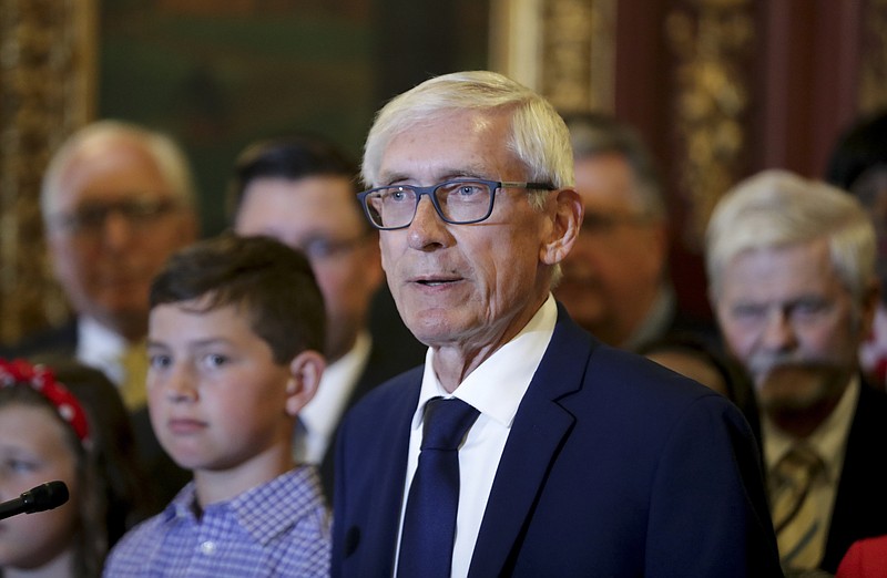 FILE - In this July 3, 2019 file photo, Wisconsin Gov. Tony Evers takes questions after signing the budget at the State Capitol in Madison, Wis. Wisconsin Republicans are proposing a constitutional amendment that would prevent the governor from using his or her partial veto powers to increase spending in any bills. Sen. Dave Craig and Rep. Mike Kuglitsch began circulating the amendment for co-sponsors Monday, June 8, 2019. The move comes after Democratic Gov. Evers used his partial veto powers last week to increase funding for K-12 schools by $65 million. (Steve Apps/Wisconsin State Journal via AP File)