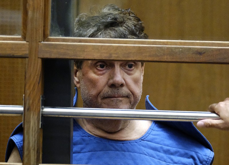 FILE - In this July 1, 2019 file photo Dr. George Tyndall, the former University of Southern California gynecologist accused of sexual assault, listens during an arraignment at Los Angeles Superior court in Los Angeles. Judge Teresa Sullivan on Tuesday, July 9, 2019, lowered Tyndall's bail from nearly $2.1 million to $1.6 million, which he may be able to post using his condominium as collateral. (AP Photo/Richard Vogel, File)