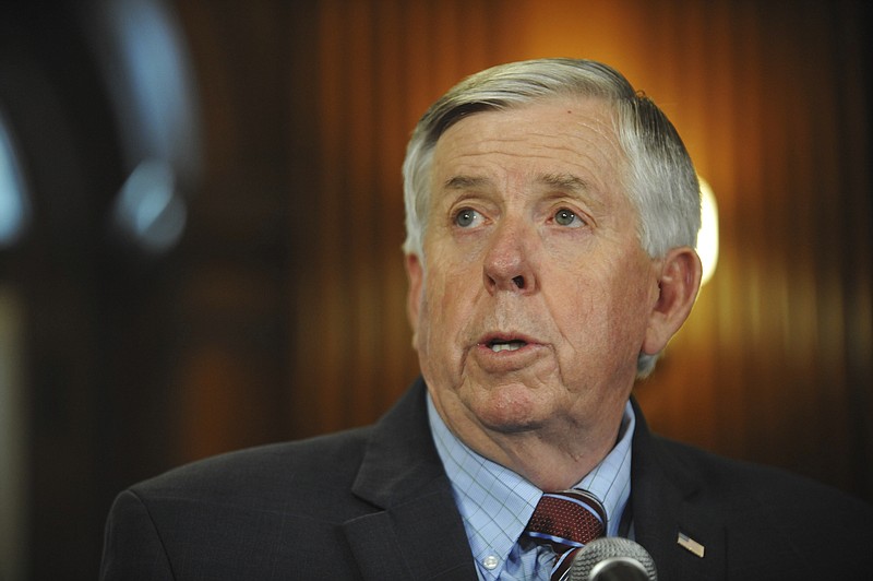 FILE - In this May 29, 2019 file photo, Gov. Mike Parson addresses the media during a news conference in his Capitol office in Jefferson City, MO. Hundreds of Missouri prisoners serving mandatory sentences for largely nonviolent offenses could become eligible for parole under a new law enacted Tuesday, July 9, that Gov. Parson touted as a criminal justice reform. (Julie Smith/The Jefferson City News-Tribune via AP File)