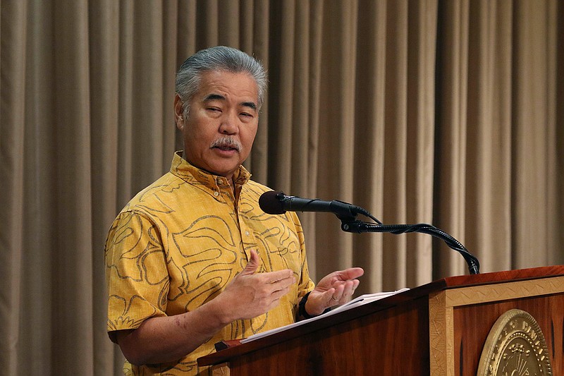 Hawaii Gov. David Ige speaks at a news conference in Honolulu on Tuesday, July 9, 2019 about legislation he will veto. Ige is vetoing a bill that would require websites like Airbnb to collect and pay taxes on behalf of short-term vacation rental hosts. (AP Photo/Audrey McAvoy)