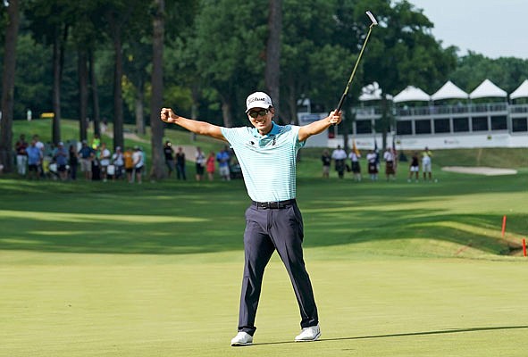 In this July 15, 2018, file photo, Michael Kim celebrates after winning the John Deere Classic in Silvis, Ill.