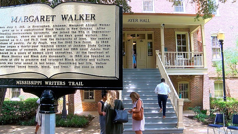In this image take from video on Monday, July 8, 2019, the new Mississippi Writers Trail marker honoring novelist and poet Margaret Walker Alexander, stands in the foreground of Ayers Hall on the Jackson State University campus, after being unveiled in Jackson, Miss. Walker was an English professor from 1949 to 1979. In 1942, she became the first African American woman to win the Yale Prize for her poetry collection, "For My People." One of her best known novels, "Jubilee," was published in 1966 and tells of a biracial woman born into slavery in the American South. (WLBT via AP)