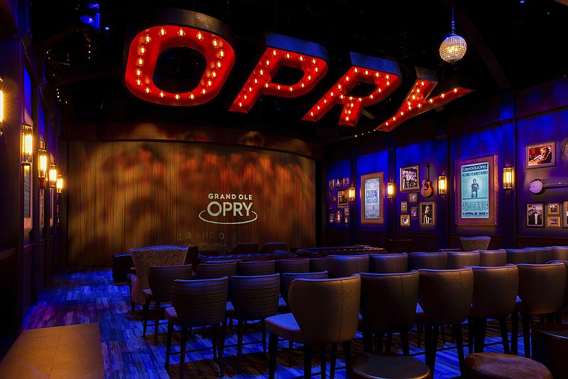 This June 13, 2019 photo released by the Grand Ole Opry shows the Circle Room, where a new immersive film explains the history of the Grand Ole Opry while showing video clips of over 100 different artists on stage. The 14-minute film is hosted by Garth Brooks and Trisha Yearwood. (Grand Ole Opry via AP)