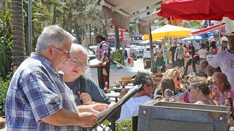 Miami Beach may send secret shoppers to identify sidewalk cafe operators who don't advertise prices or try to trick customers into ordering expensive food and drinks. (C.M. GUERRERO/Miami Herald/TNS)