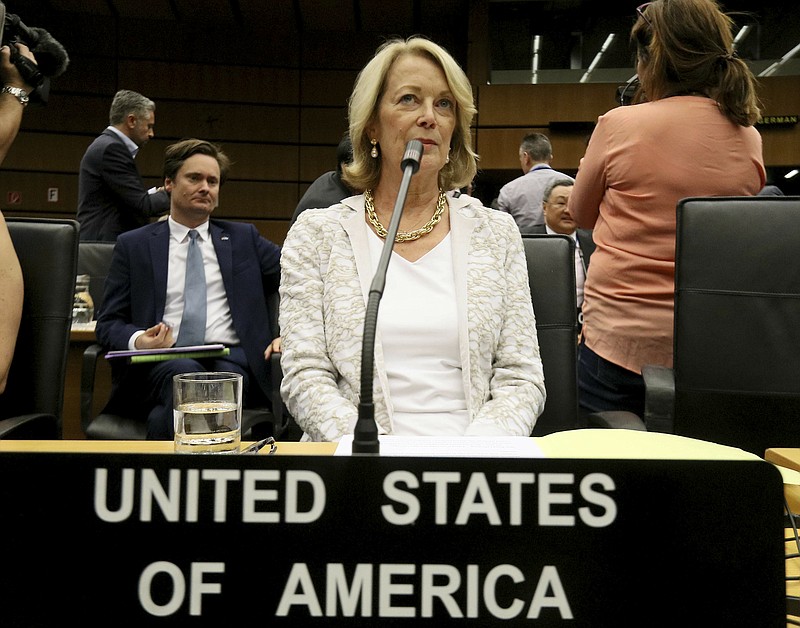 U.S. Ambassador Jackie Wolcott waits for the start of the International Atomic Energy Agency, IAEA, board of governors meeting at the International Center in Vienna, Austria, Wednesday, July 10, 2019. (AP Photo/Ronald Zak)