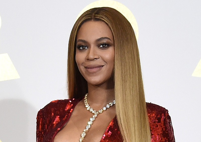 In this Feb. 12, 2017 file photo, Beyonce poses in the press room at the 59th annual Grammy Awards in Los Angeles. Beyonce is dropping a new original song from Disney's live-action "Lion King." The song, "Spirit," will be released later Tuesday, July 9, 2019, and should get a push for Academy Award consideration. (Photo by Chris Pizzello/Invision/AP, File)