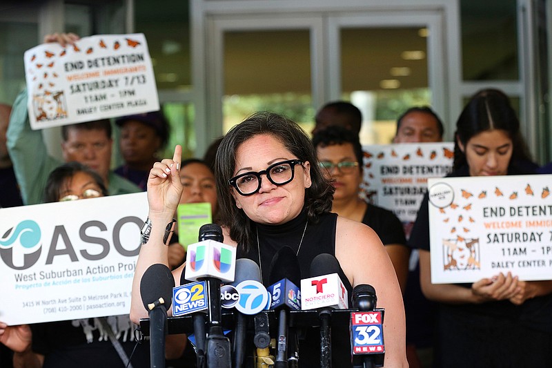 Mony Ruiz-Velasco, director of PASO West Suburban Action Project, addresses reporters during a new conference outside the U.S. Citizenship and Immigration Services offices in Chicago, Thursday, July 11, 2019.  A nationwide immigration enforcement operation targeting people who are in the United States illegally is expected to begin this weekend (AP Photo/Amr Alfiky)