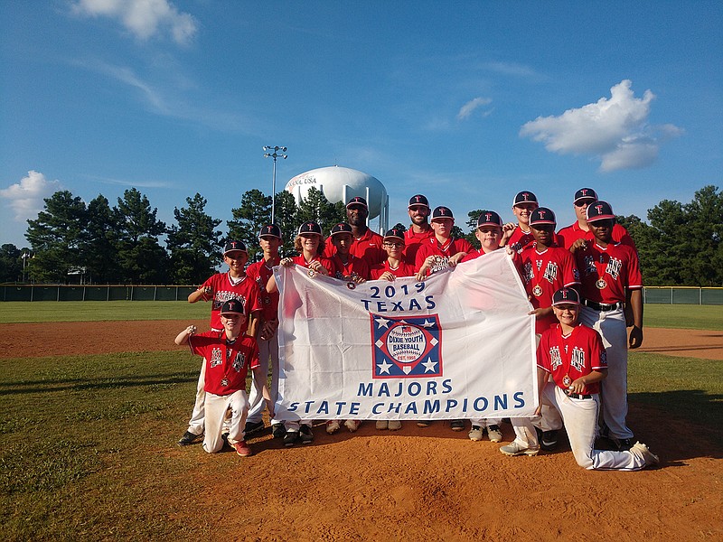Texarkana North's baseball team holds up a banner celebrating their Texas Dixie 12u Majors state championship on Tuesday. Texarkana defeated Nacogdoches, 8-4, to clinch the championship. The team of all-stars advances to the Dixie World Series in Ruston, La., later this month. (Submitted photo)
