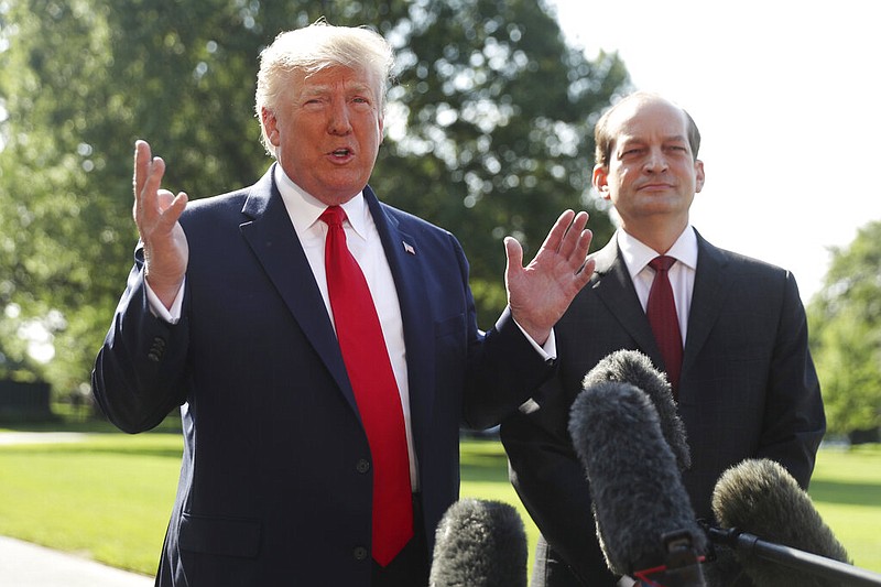 President Donald Trump speaks to members of the media with Secretary of Labor Alex Acosta on the South Lawn of the White House, Friday, July 12, 2019, before Trump boards Marine One for a short trip to Andrews Air Force Base, Md. and then on to Wisconsin.