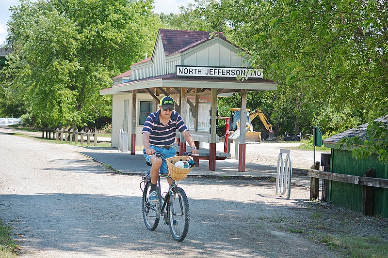 Roger Fischer rides his bike Thursday, July 11, 2019, along the North Jefferson access of the Katy Trail. 