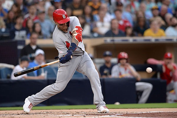In this June 28 file photo, Yadier Molina of the Cardinals singles during the second inning of a game against the Padres in San Diego.