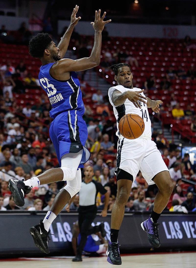 Brooklyn Nets' Ahmed Hill, right, blocks a pass from Orlando Magic's Amile Jefferson during the second half of an NBA summer league basketball game Wednesday, July 10, 2019, in Las Vegas. (AP Photo/John Locher)