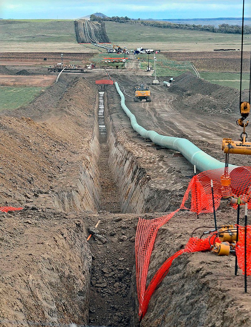 The company that built the Dakota Access Pipeline, shown here in October 2016 when construction was underway, is seeking state approval to build a new pumping station in Emmons County. Opponents of the Dakota Access oil pipeline plan to request a hearing on a proposal to nearly double the pipeline's capacity.  (Tom Stromme/The Bismarck Tribune via AP)