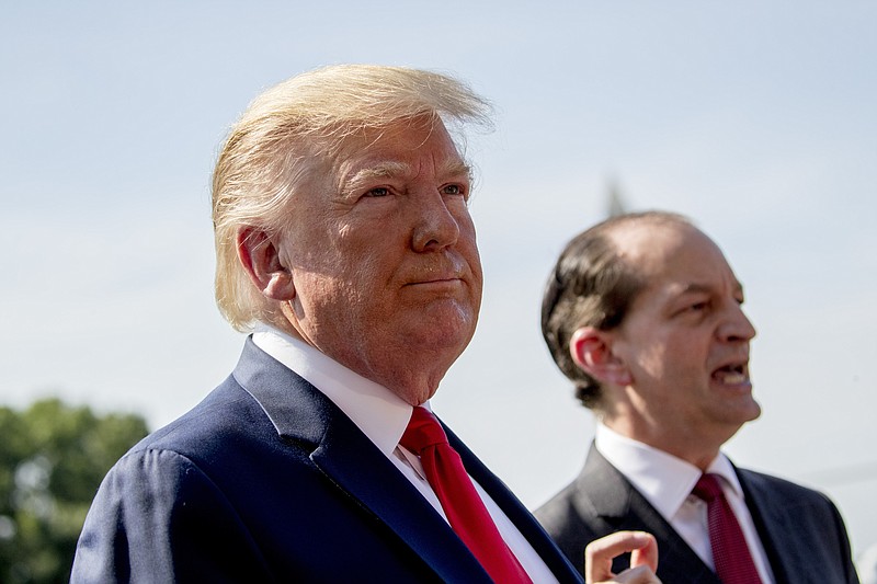 Labor Secretary Alex Acosta, right, accompanied President Donald Trump, left, speaks to members of the media on the South Lawn of the White House in Washington, Friday, July 12, 2019, before Trump boards Marine One for a short trip to Andrews Air Force Base, Md. and then on to Wisconsin. Trump says Labor Secretary Alex Acosta to step down, move comes in wake of handling of Jeffrey Epstein case. (AP Photo/Andrew Harnik)