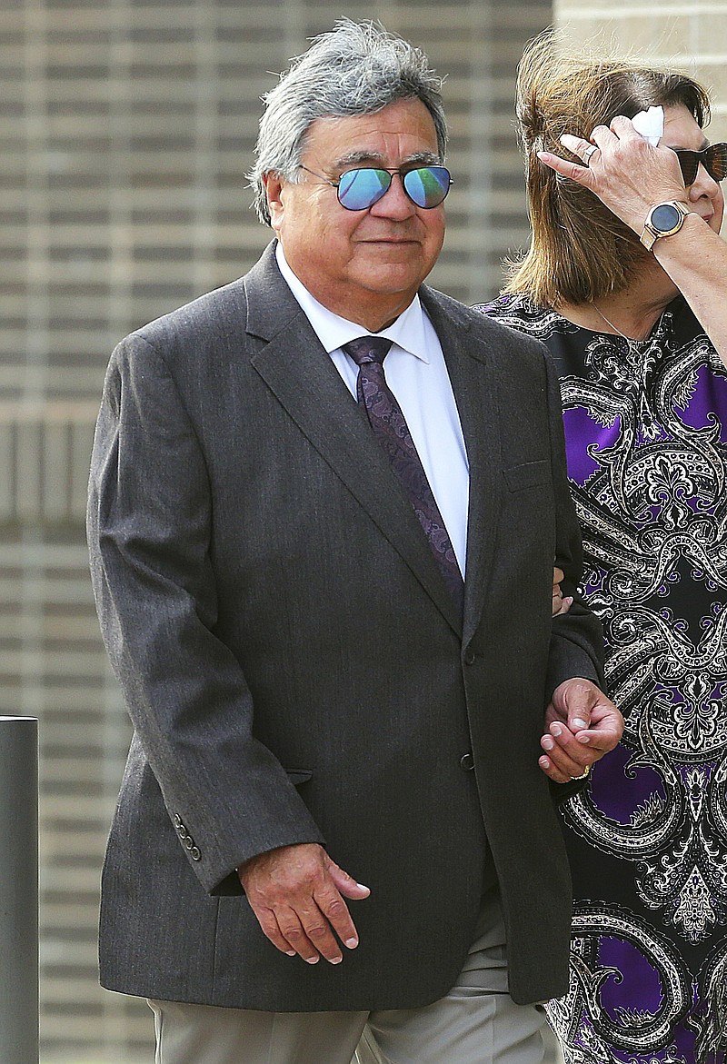 This July 3, 2019 photo shows State District Judge Rodolfo "Rudy" Delgado as he walks into the Federal Courthouse at Bentsen Tower in McAllen, Texas. The former state district judge in South Texas faces up to 70 years in federal prison after being convicted of accepting bribes for favorable rulings while on the bench. Delgado of Edinburg was convicted Thursday, July 11, 2019, of conspiracy, obstruction of justice, federal program bribery and travel act bribery. The 65-year-old Delgado, who was tried in McAllen, remains free pending sentencing.(Joel Martinez/The Monitor via AP)